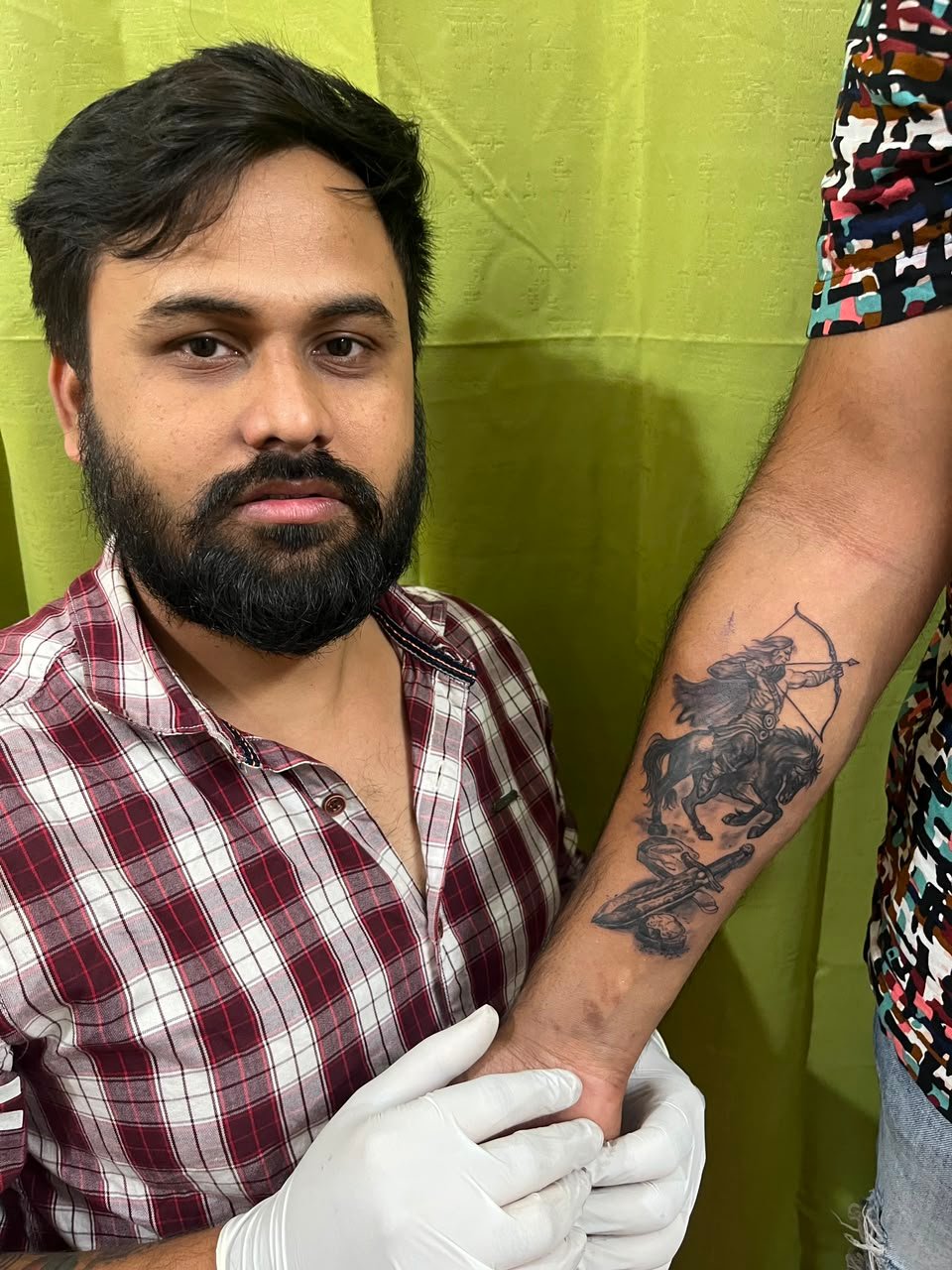 Tattoo artist preparing a custom tattoo design